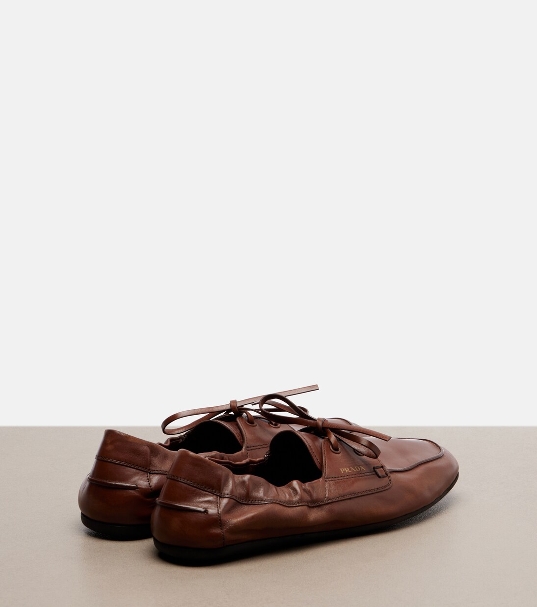 Shuffle leather boat shoes | Prada