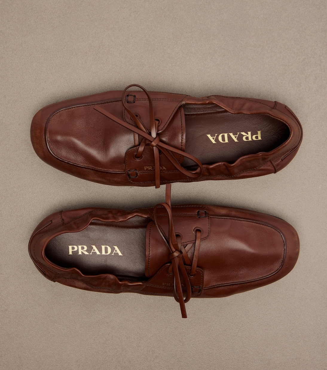 Shuffle leather boat shoes | Prada