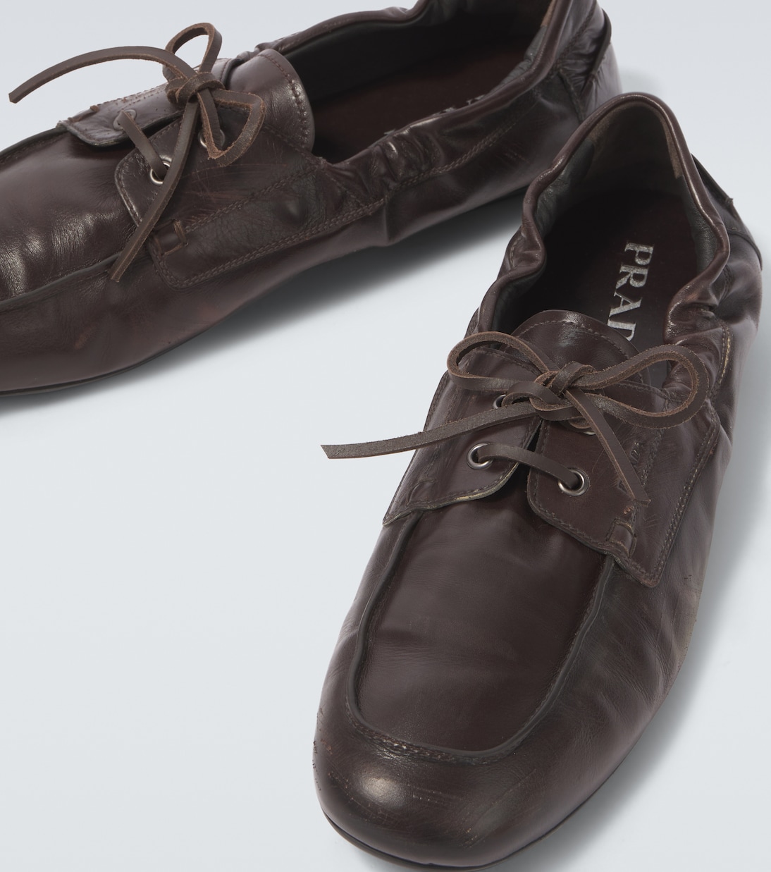 Shuffle leather boat shoes | Prada