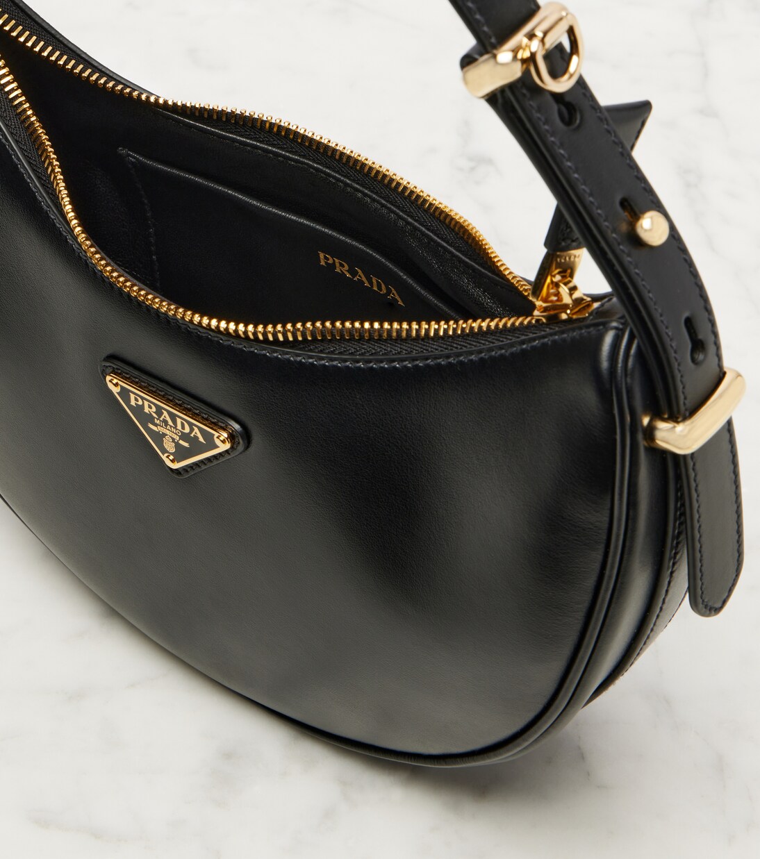 Arqué Small leather shoulder bag | Prada