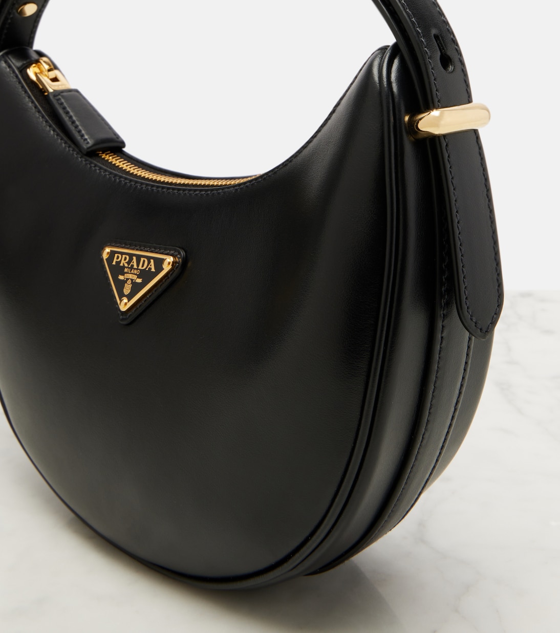 Arqué Small leather shoulder bag | Prada