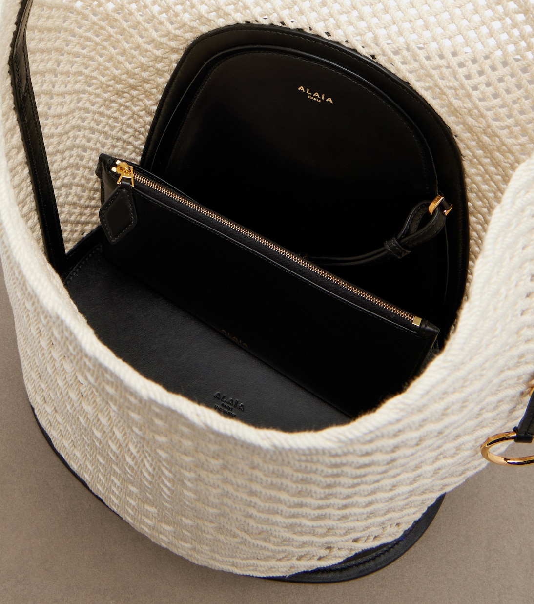 Hip Large leather-trimmed bucket bag | Alaïa