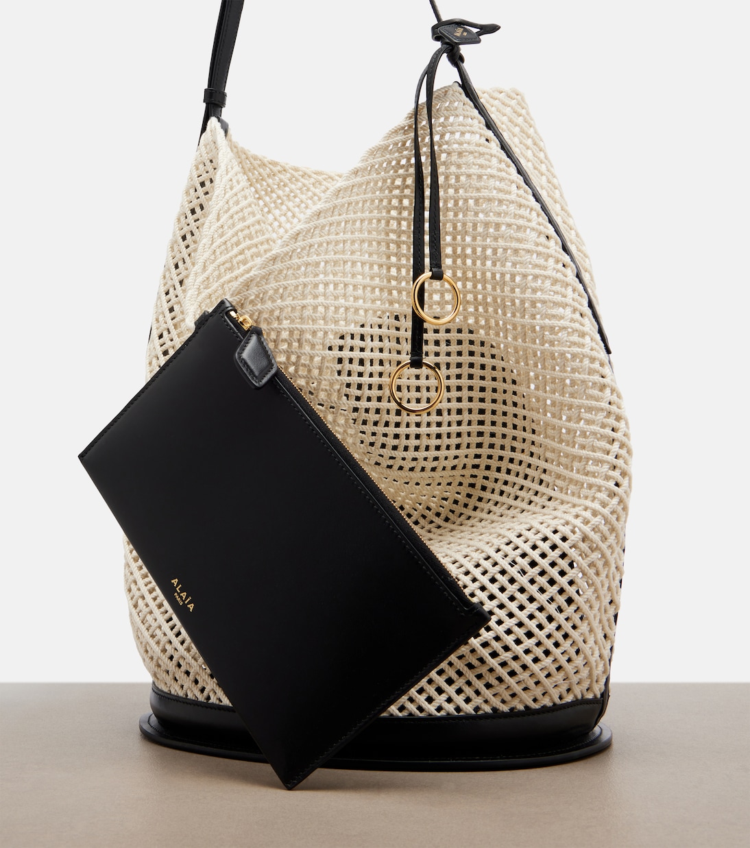 Hip Large leather-trimmed bucket bag | Alaïa