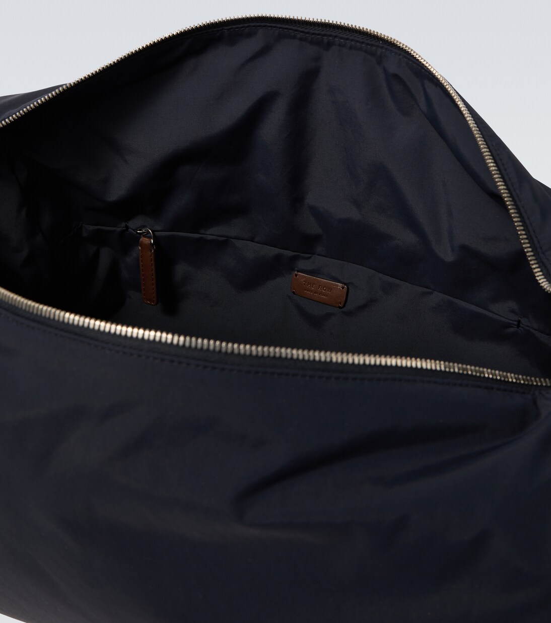 Logan E/W leather-trimmed crossbody bag | The Row