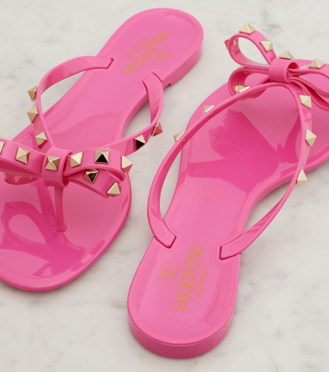 Rockstud bow-detail thong sandals | Valentino Garavani