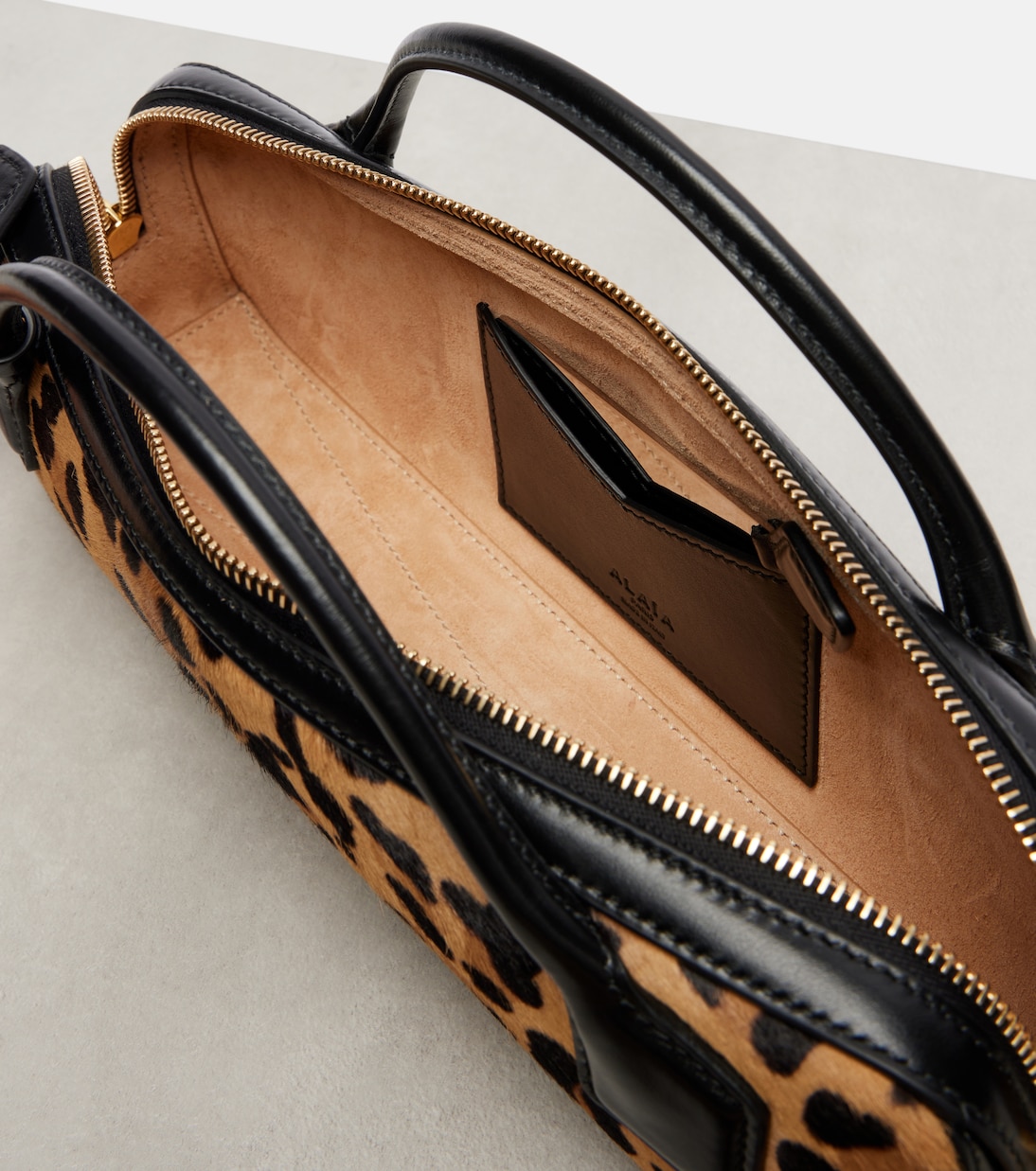 Le Teckel leopard-print calf hair clutch | Alaïa