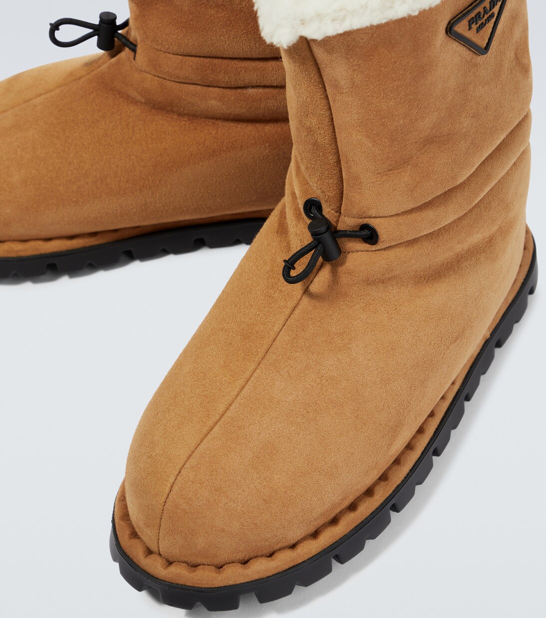 Suede shearling-lined logo boots | Prada