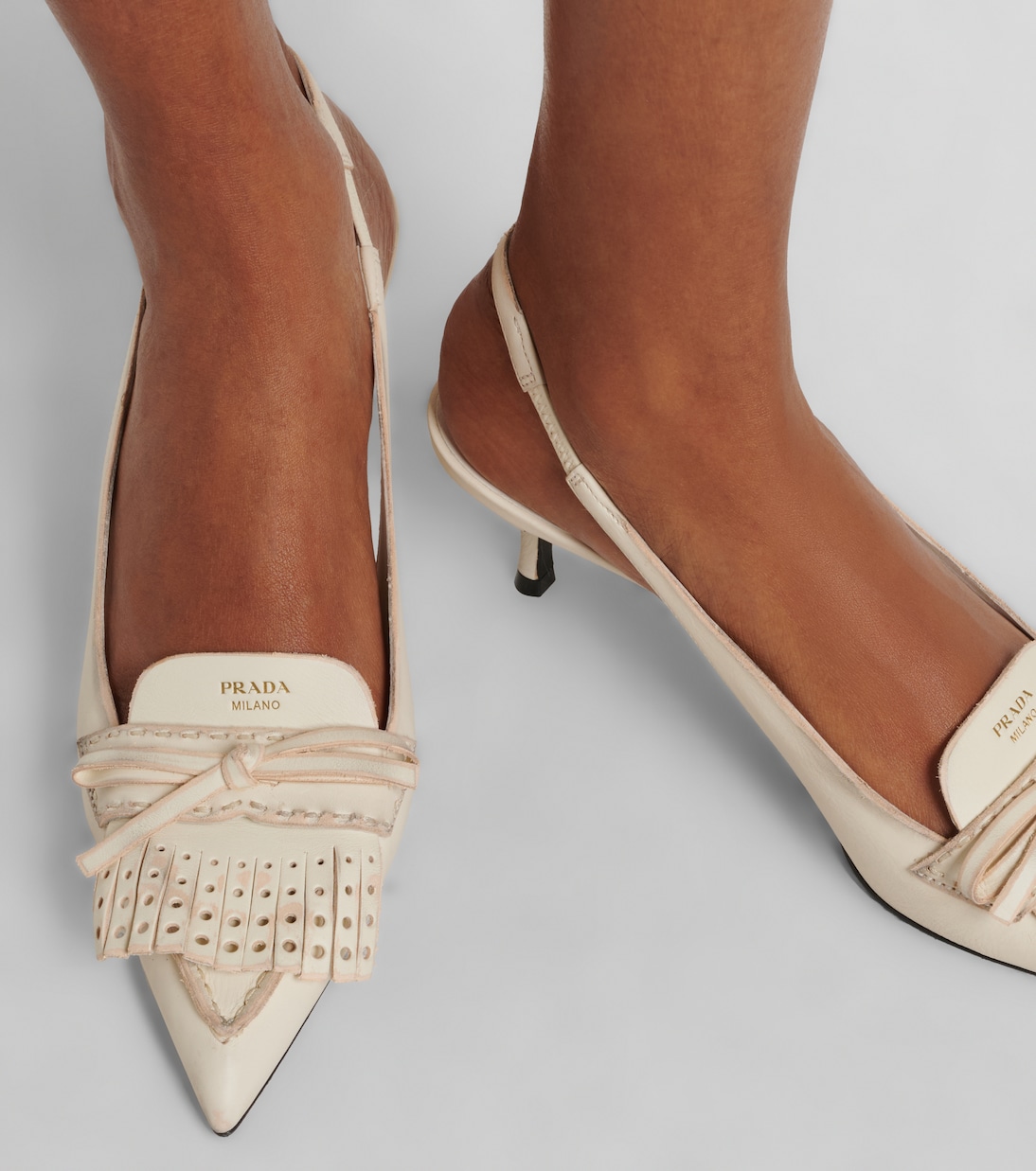 Bow-detail leather slingback pumps | Prada