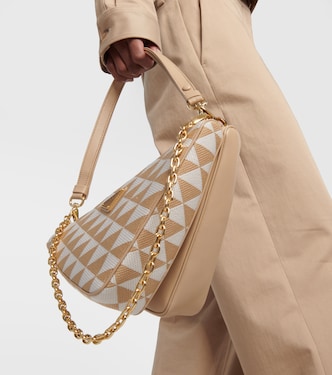 Symbole leather mini-bag in beige - Prada | Mytheresa