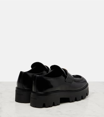 Logo leather platform loafers in black - Prada | Mytheresa
