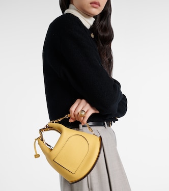 Pin Twist leather shoulder bag in yellow - Delvaux | Mytheresa
