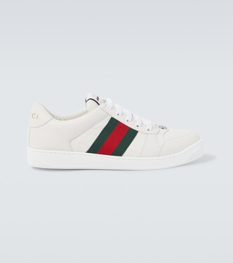 Screener debossed leather sneakers | Gucci