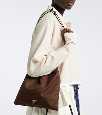 Prada Wish leather-trimmed Re-Nylon pouch in brown - Prada | Mytheresa