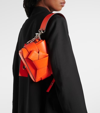 Musubi leather shoulder bag in orange - Acne Studios | Mytheresa