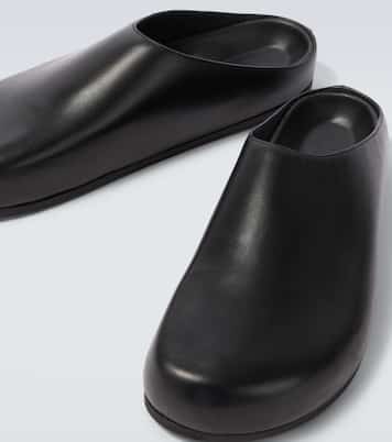 Wearing leather mules | Studio Nicholson