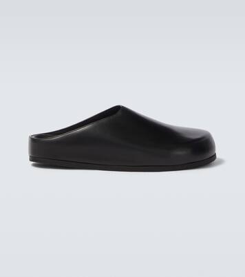 Wearing leather mules | Studio Nicholson