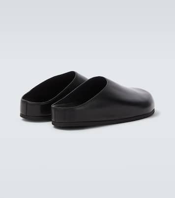 Wearing leather mules | Studio Nicholson
