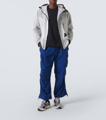 Paneled PU raincoat | And Wander