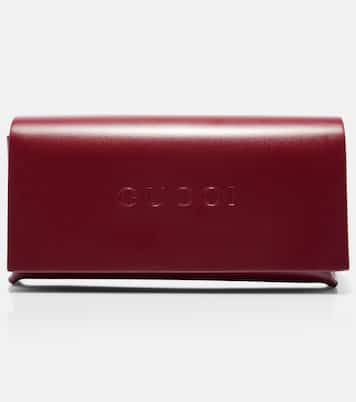 Crystal-embellished oval sunglasses | Gucci