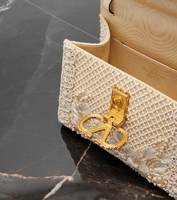 VSling Mini embellished top-handle bag | Valentino Garavani
