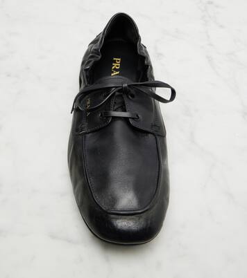 Shuffle leather boat shoes | Prada