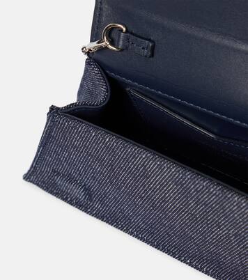 Superamini Yigit denim clutch | Amina Muaddi