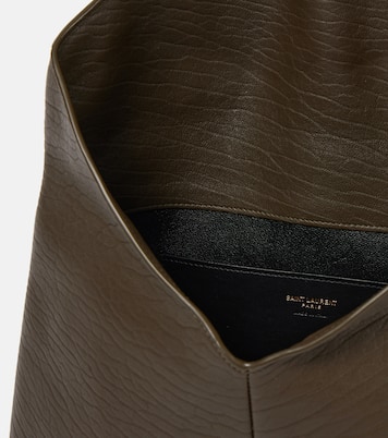 Cassandre Large leather clutch | Saint Laurent