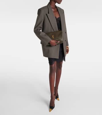 Cassandre Large leather clutch | Saint Laurent