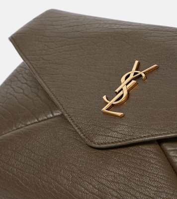 Cassandre Large leather clutch | Saint Laurent