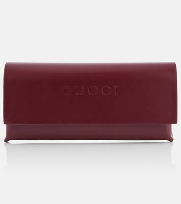 Ovale Sonnenbrille mit Kristallen | Gucci