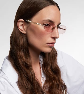 Logo embellished oval sunglasses | Gucci