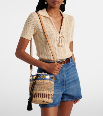 VLogo Small embellished raffia-effect bucket bag | Valentino Garavani