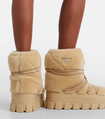 Shearling and leather snow boots | Prada