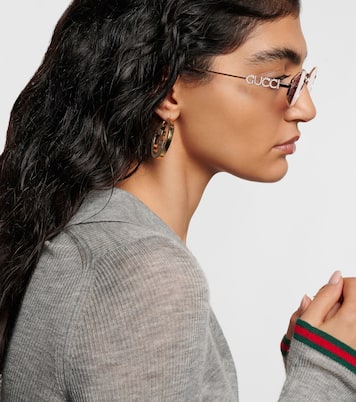 Logo embellished oval sunglasses | Gucci