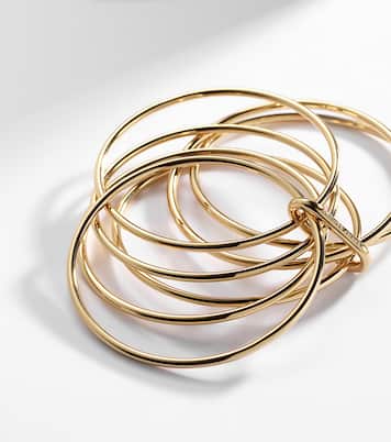 Set aus sieben Armreifen, 10kt vergoldet | Jennifer Fisher