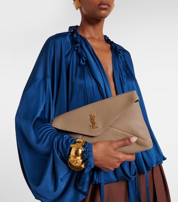 Cassandre Large leather clutch | Saint Laurent