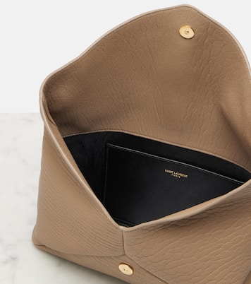Cassandre Large leather clutch | Saint Laurent