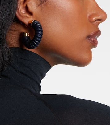 Leather-trimmed hoop earrings | Alaïa