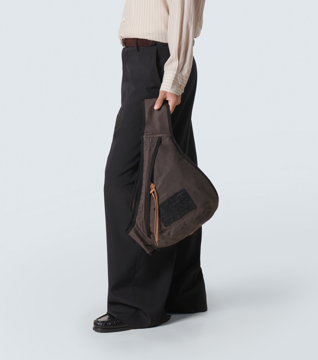 Sling leather-trimmed canvas backpack in grey - Acne Studios 
