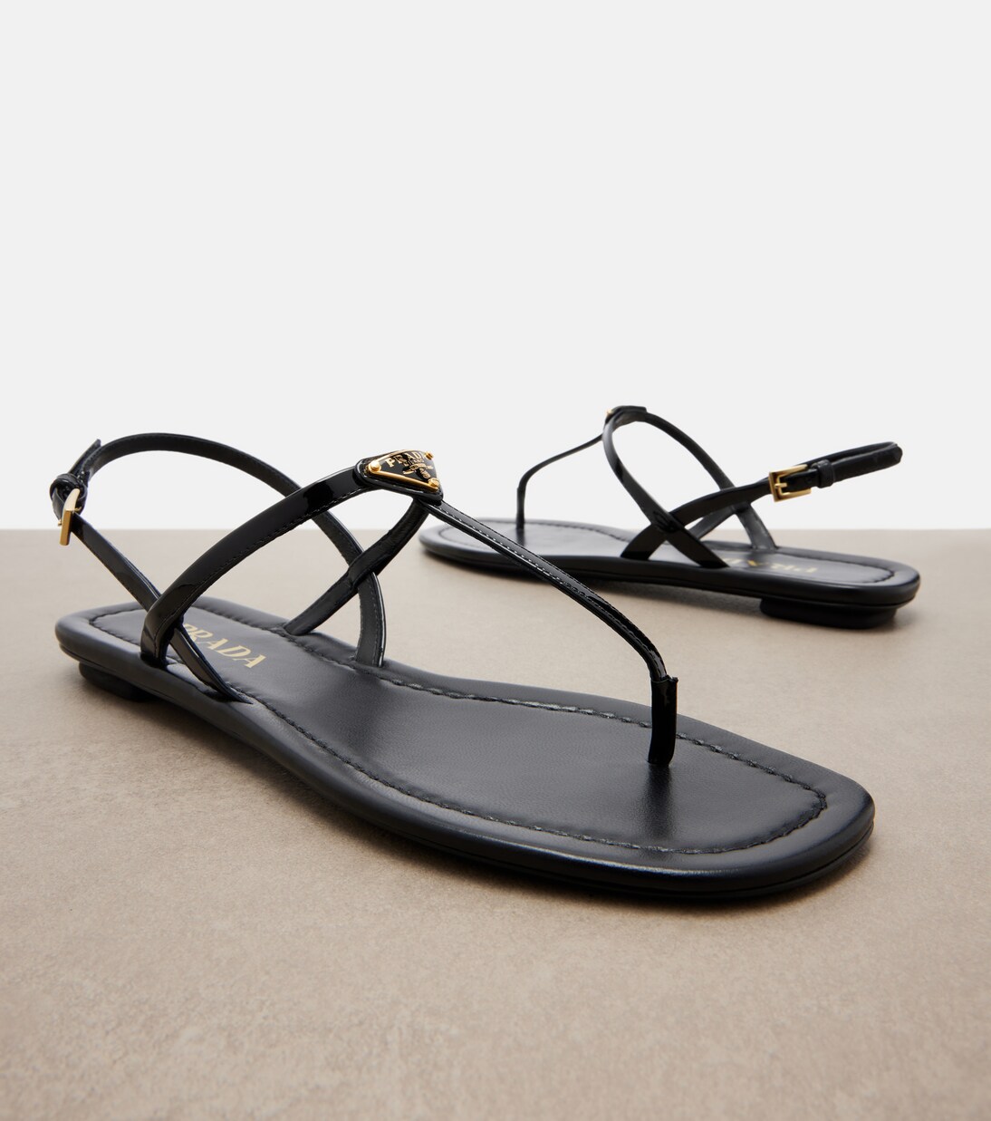 Patent leather thong sandals | Prada