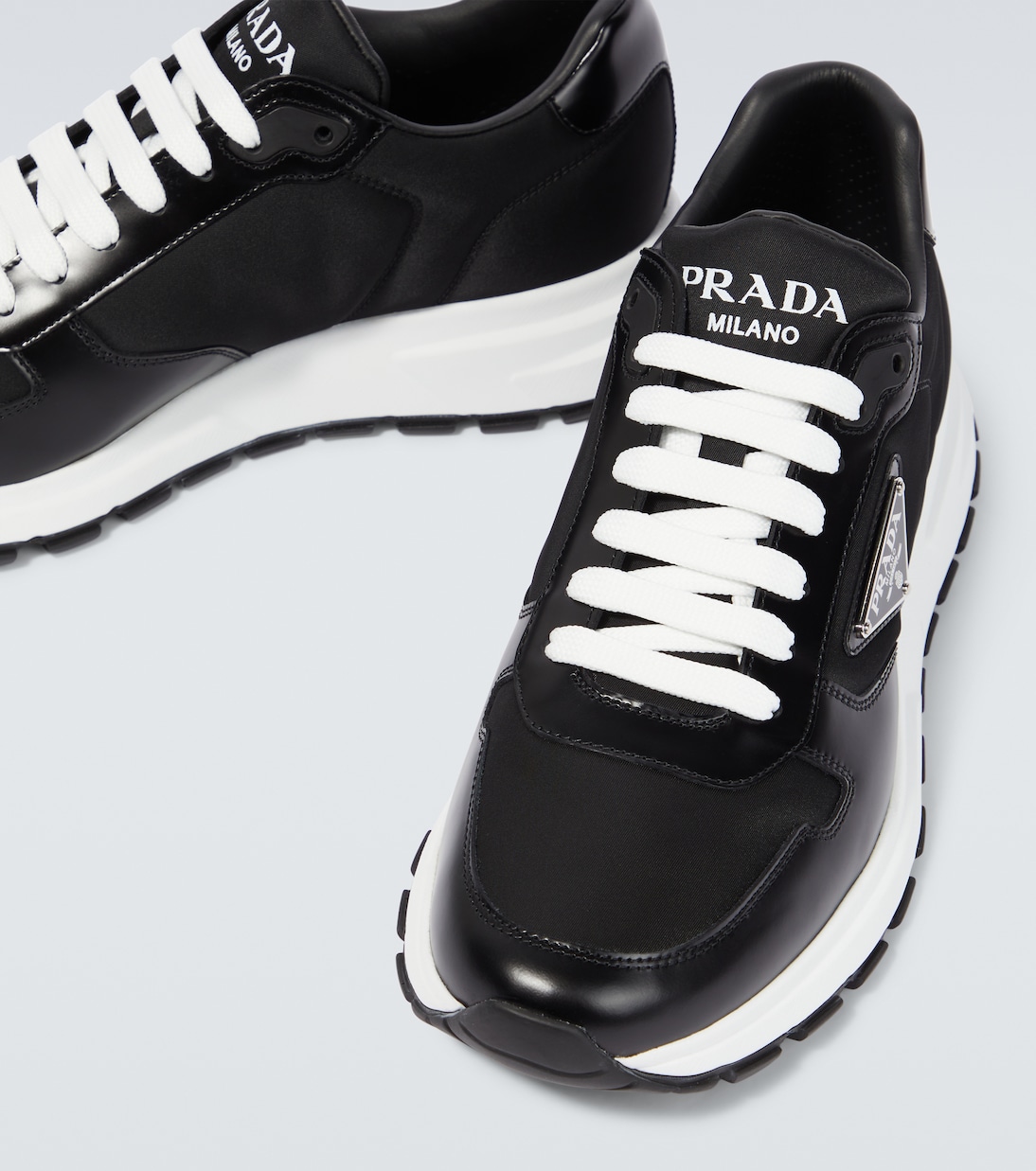 Sneakers in Re Nylon e pelle in Nero Prada Mytheresa