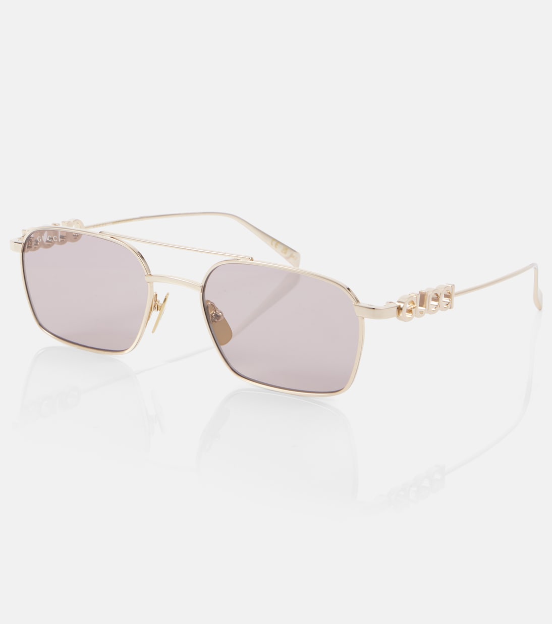 Occhiali da sole aviator GUCCI con dettagli in script, stile giovane e trendy.