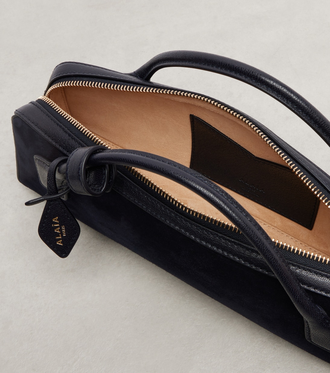 Le Teckel Small calf hair clutch | Alaïa