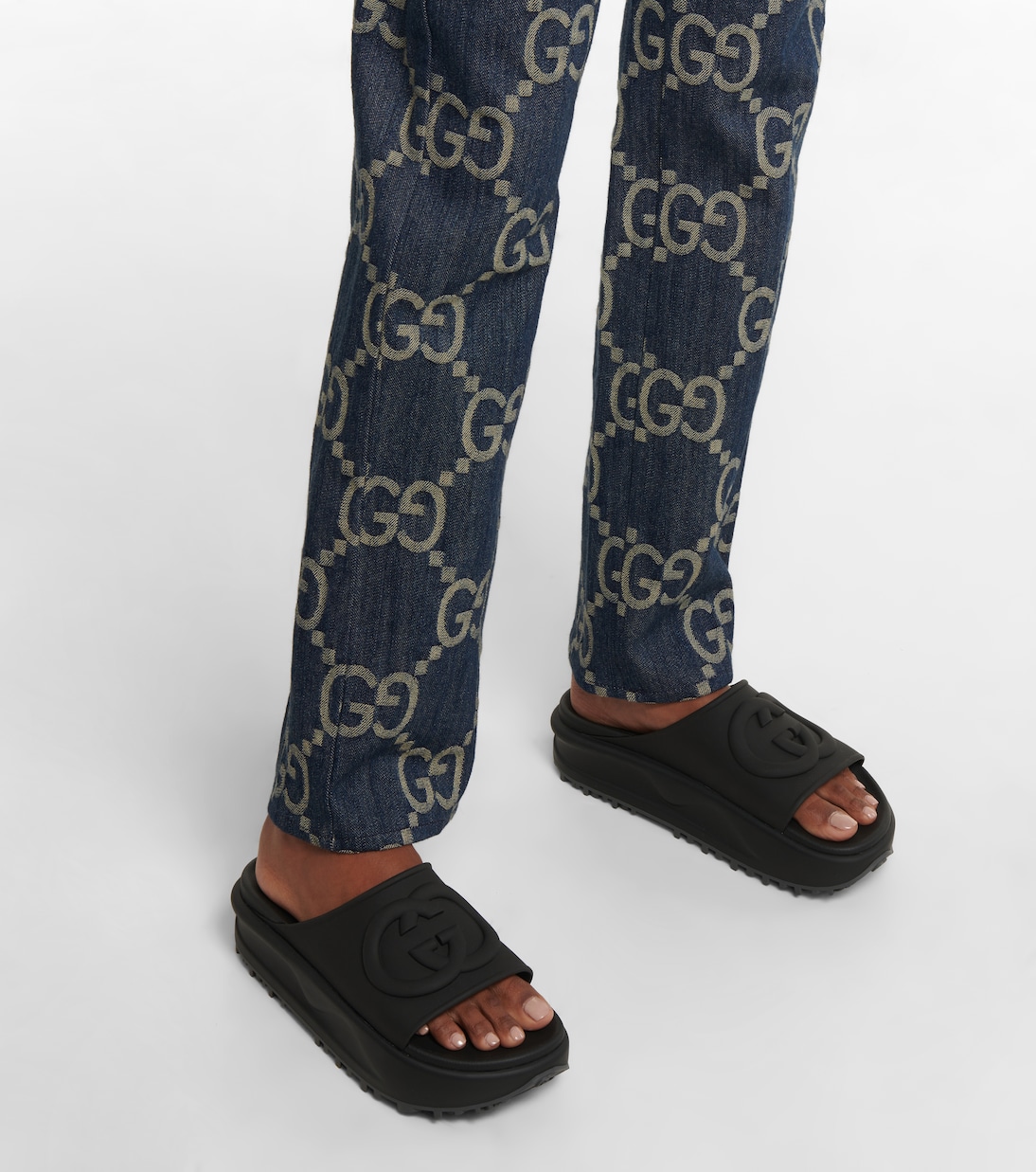 GG rubber slides in black Gucci Mytheresa