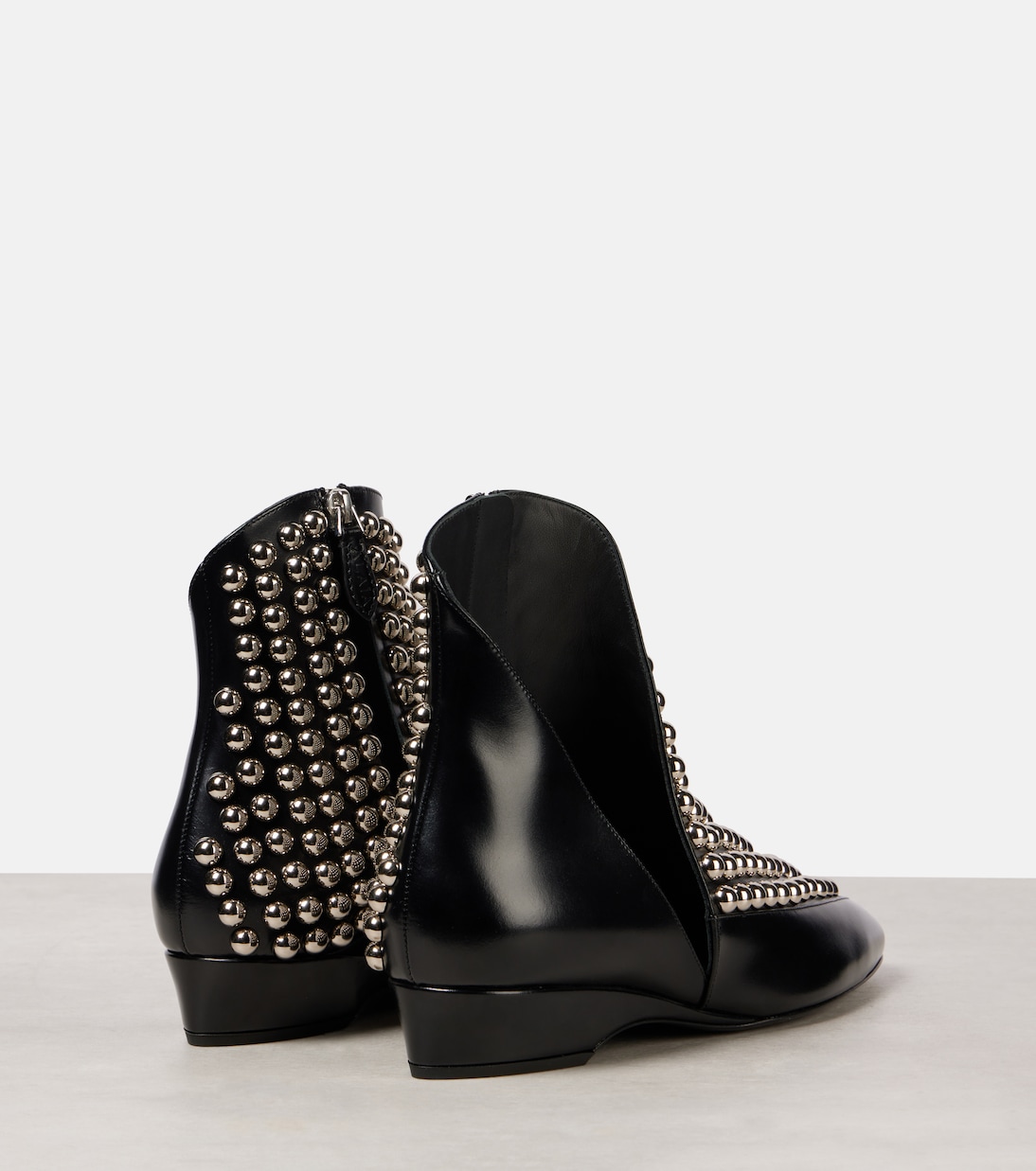 Stivaletti in pelle con borchie | Alaïa