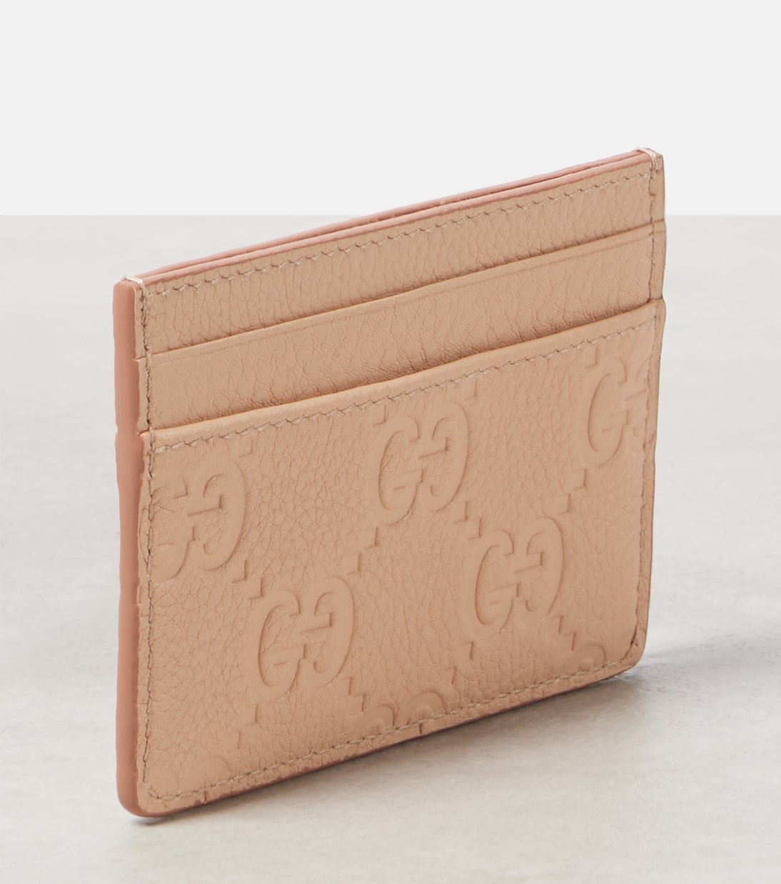 Portafoglio in pelle GUCCI GG con effetto inciso, stile giovane e moderno