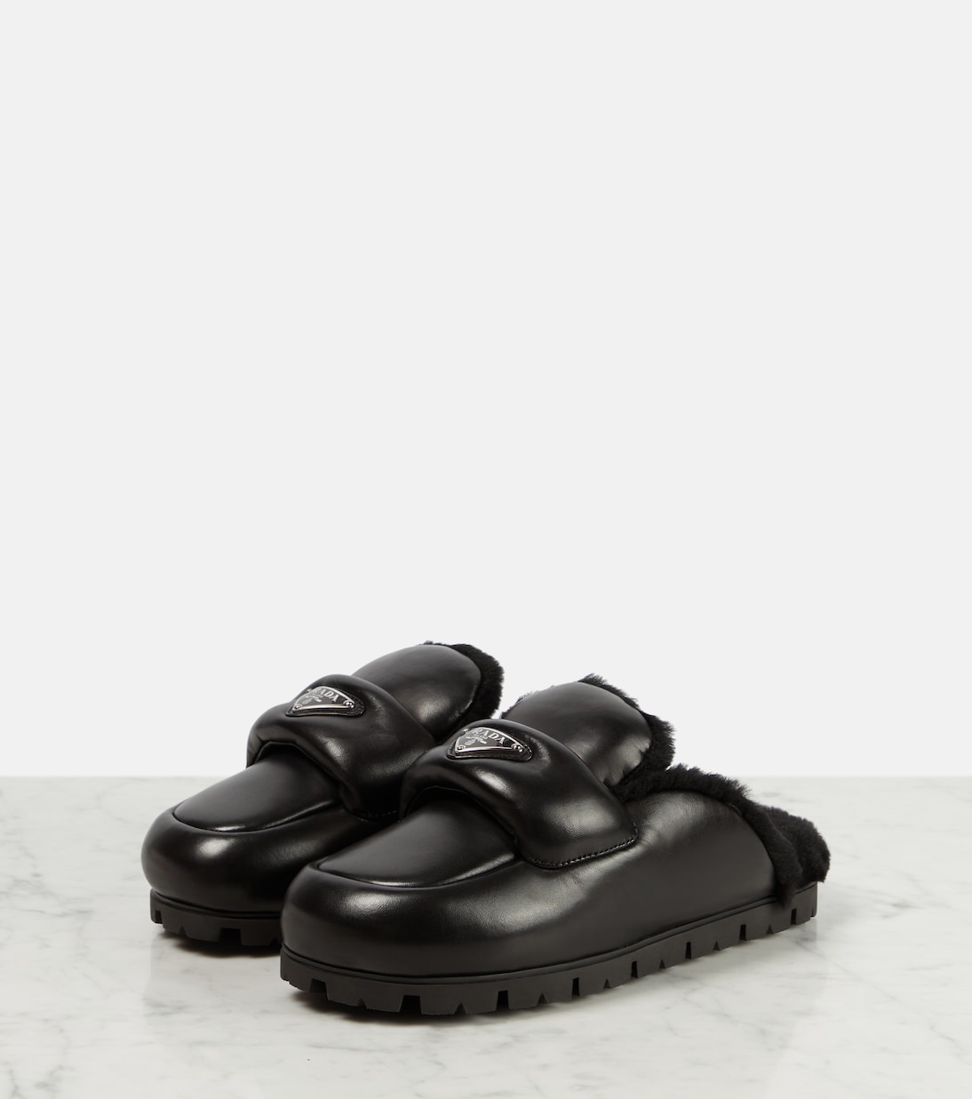 Shearling-lined leather slides | Prada