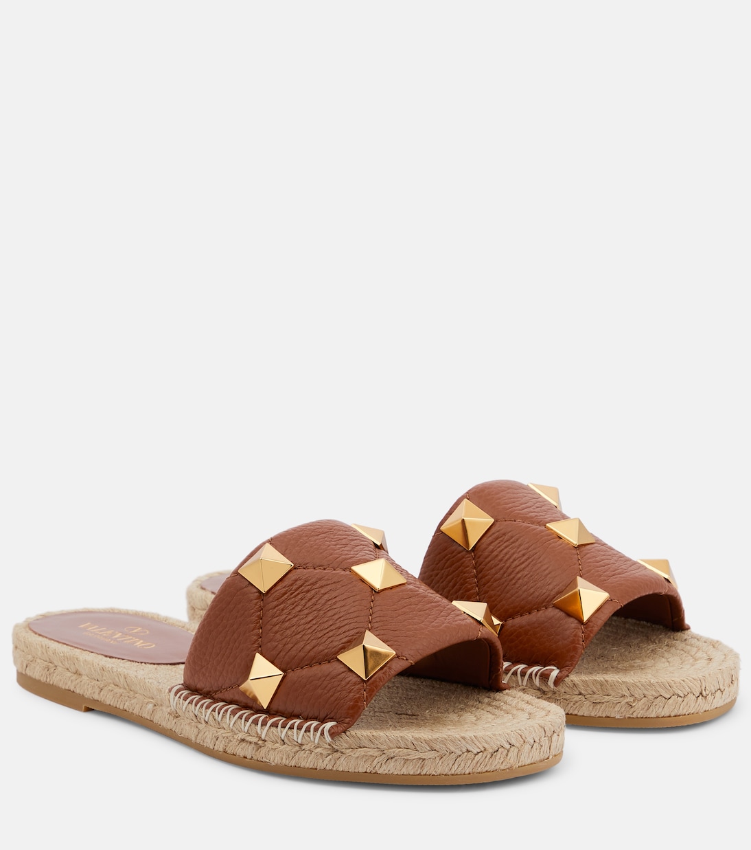 Roman Stud leather and raffia slides | Valentino Garavani