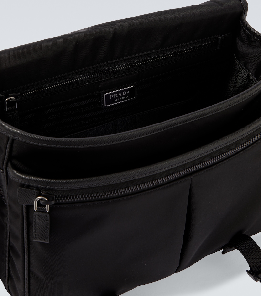 Re-Nylon leather-trimmed messenger bag | Prada