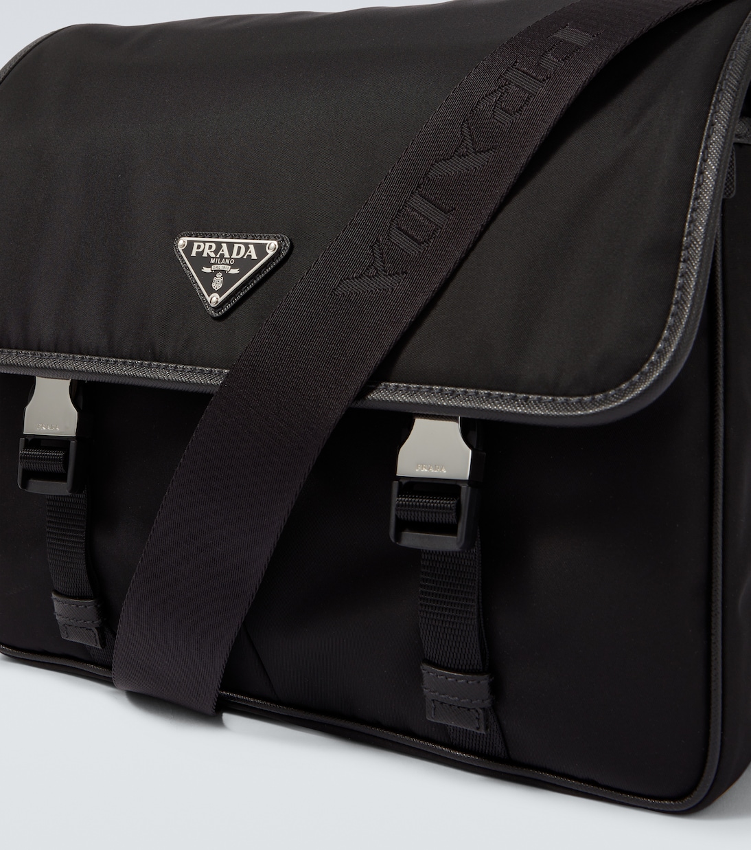 Re-Nylon leather-trimmed messenger bag | Prada